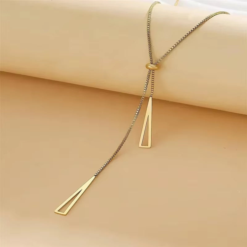 Silver Triangle Pendant Necklace worn on neckline