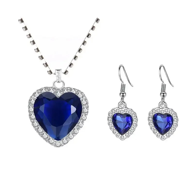 Titanic Heart of the Ocean Jewelry Set featuring a blue heart-shaped crystal necklace and matching earrings.