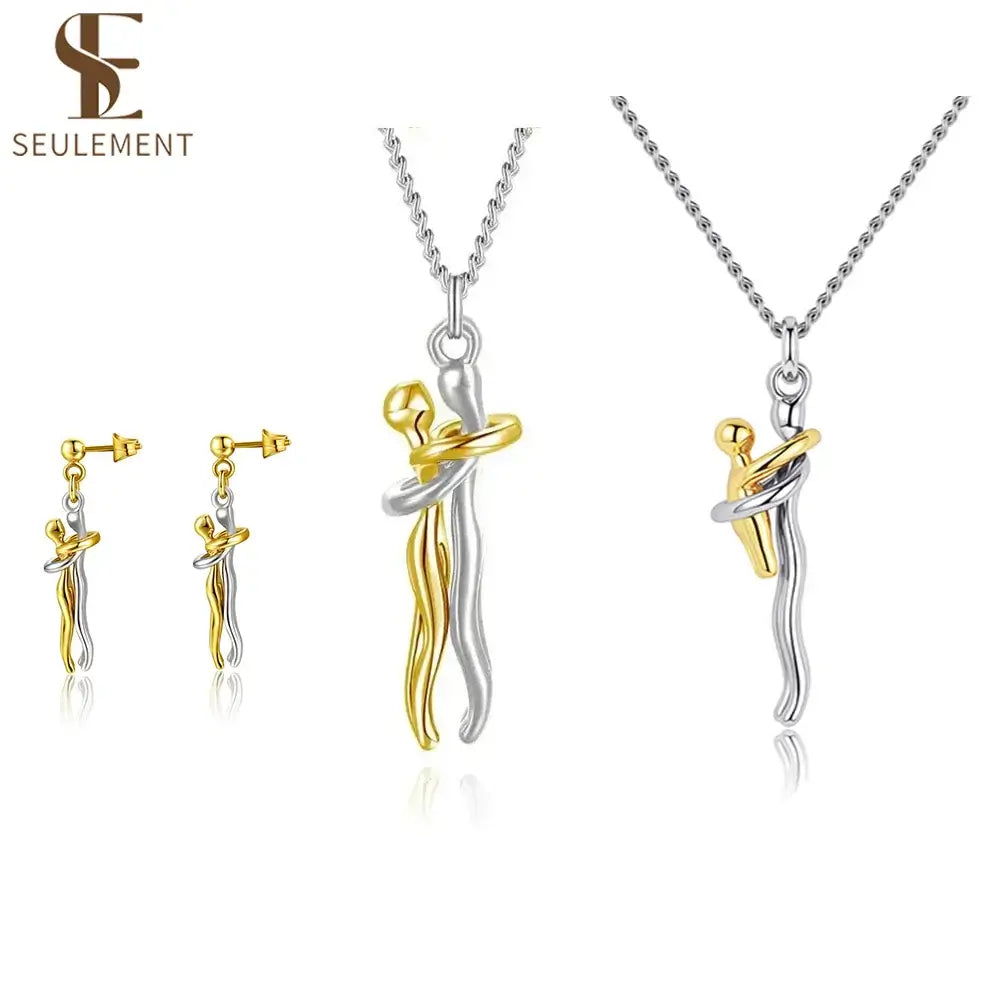 14K Gold Plated Embrace Jewelry Set featuring a beautiful embrace design pendant and earrings.