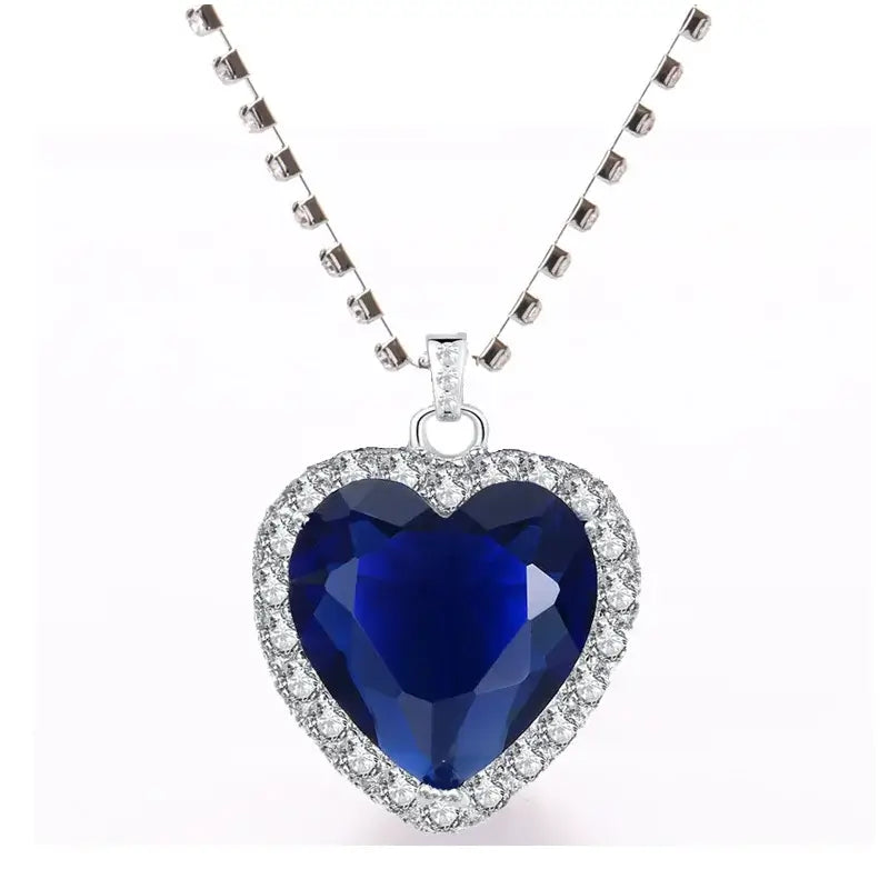 Titanic Heart of the Ocean Jewelry Set featuring a blue heart-shaped crystal pendant on a silver chain.