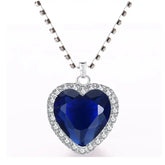 Titanic Heart of the Ocean Jewelry Set featuring a blue heart-shaped crystal pendant on a silver chain.
