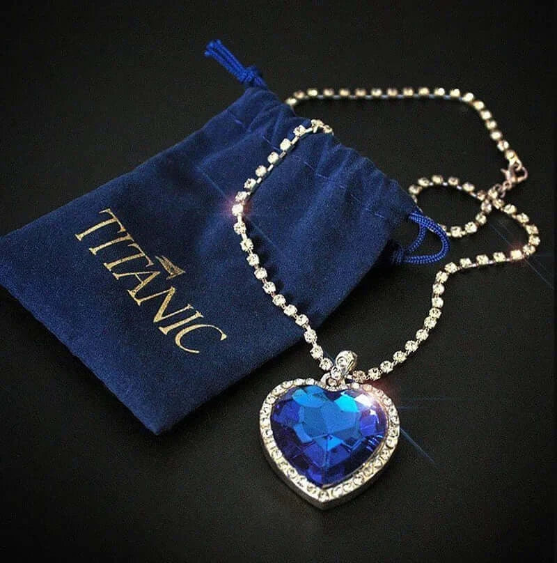 Titanic Heart of the Ocean Jewelry Set featuring a blue heart crystal necklace with a branded pouch.