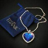 Titanic Heart of the Ocean Jewelry Set featuring a blue heart crystal necklace with a branded pouch.